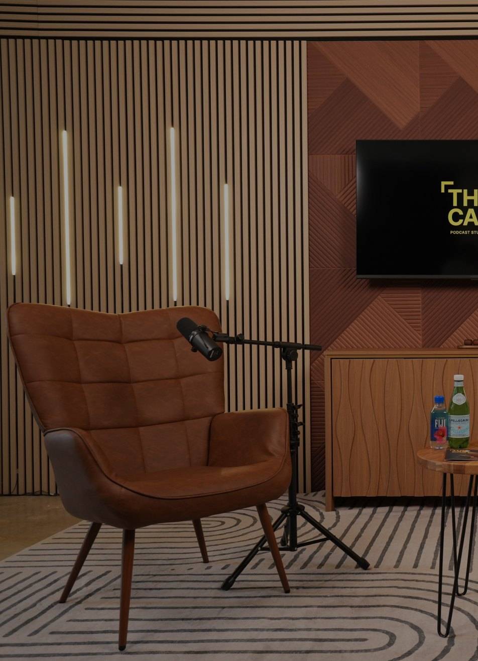 Podcast set with leather armchairs and LED lights at The Cast Studio in Fort Lauderdale