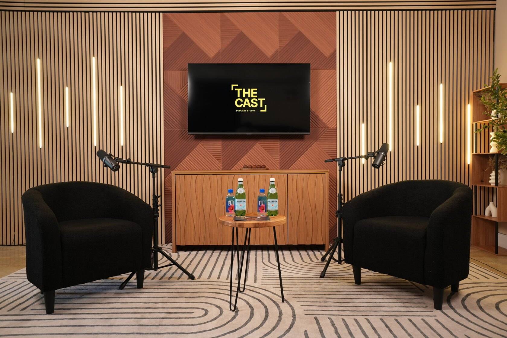 Studio #3 at The Cast Studio: two black armchairs under warm LED lighting