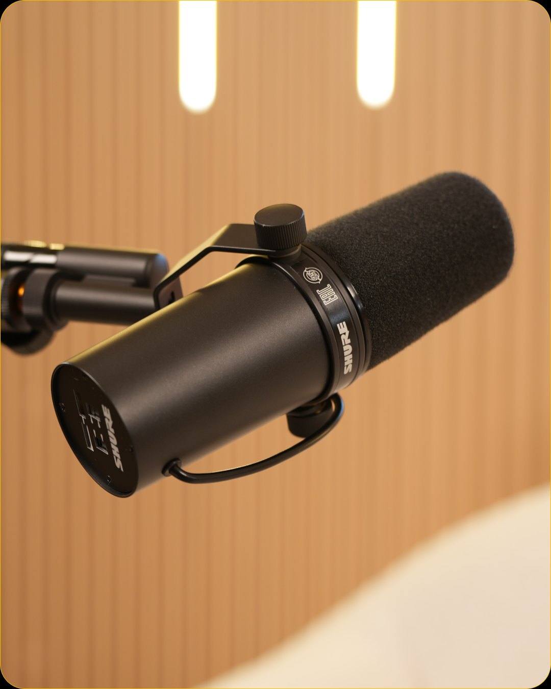 Close-up of a Shure microphone on a boom arm in Studio #1