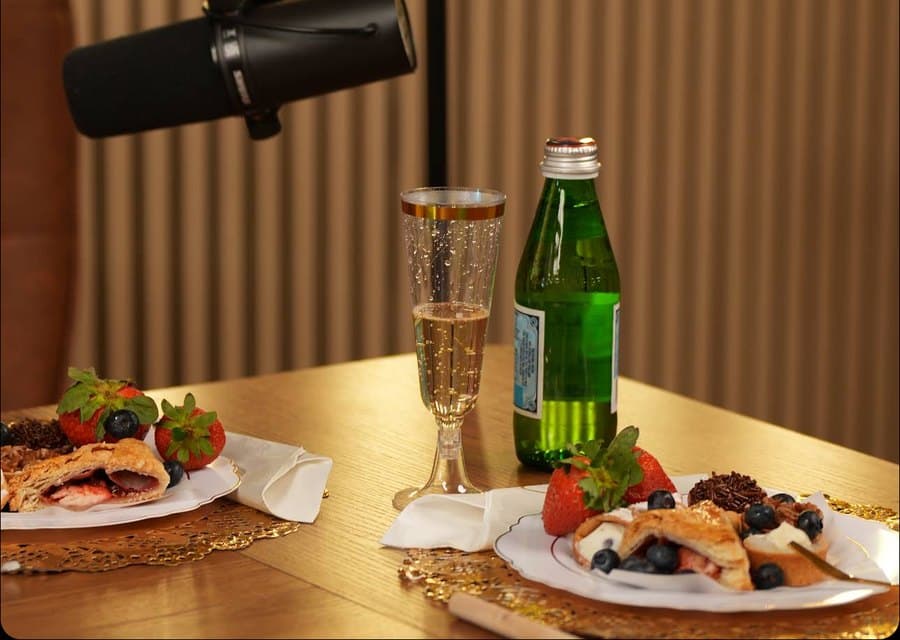 Table set with desserts and drinks for a studio shoot